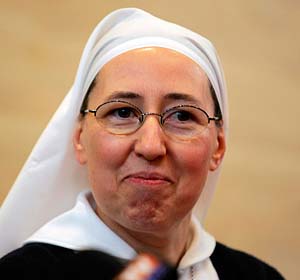 Sister Marie-Simon-Pierre attends a news conference in Aix-en-Provence, France, March 30. The French nun believes that she was healed from Parkinson's disease through the intercession of Pope John Paul II. (CNS/Reuters)